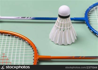 Racket and Shuttlecock badminton isolated on green background , badminton sport Concept