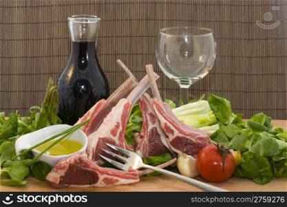 Racks of lamb. a ready to cook food composition with rack of lambs and other ingredients