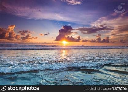 Radiant colorful sea beach sunset on Bali, Indonesia. Radiant sea beach sunset