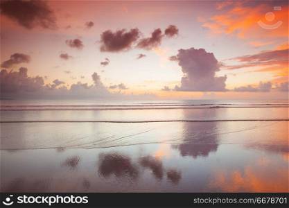 Radiant colorful sea beach sunset on Bali, Indonesia. Radiant sea beach sunset