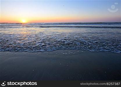 Radiant sea beach sunrise in summer time