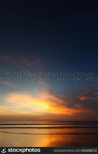 Radiant sea beach sunset on Bali. Bali sunset