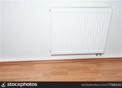 radiator hanging on the wall in the room