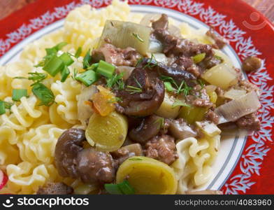 Radiatori - Pasta italian cuisine with beef and mushrooms