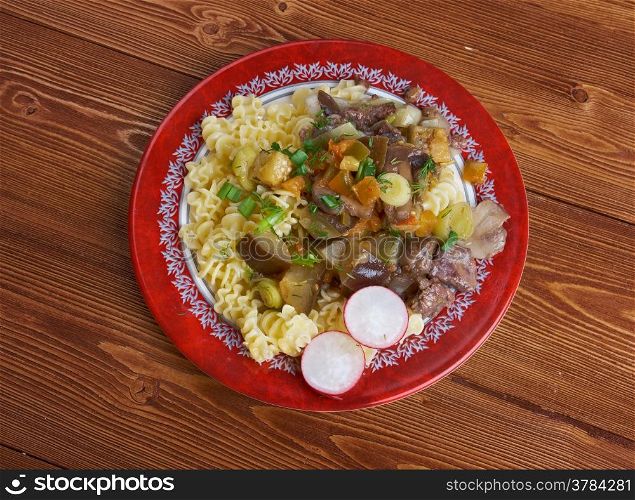 Radiatori - Pasta with beef, mushrooms, eggplant .italian cuisine