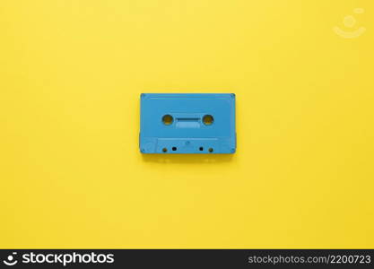 radio concept with cassette yellow background