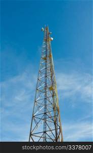 Radio telecommunications tower over blue sky