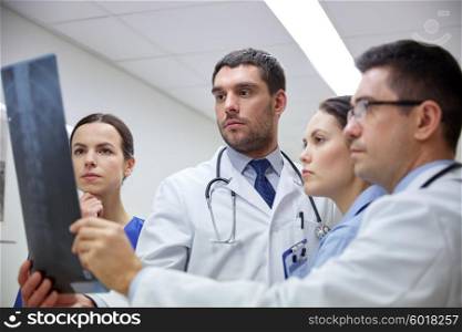 radiology, health care, people, surgery and medicine concept - group of doctors looking at x-ray scan image