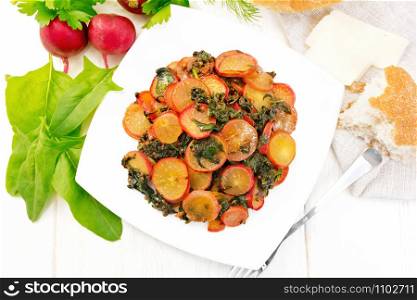 Radish stewed with spinach and spices in a plate, cheese and bread, napkin against light wooden board top