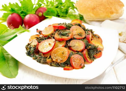 Radish stewed with spinach and spices in a plate, cheese and bread, napkin against wooden board background