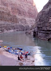 Rafters Sitting on Riverbank in Rocky Canyon