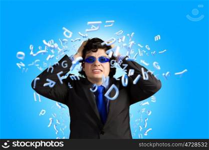 Rage and aggression. Image of depressed businessman tearing his hair