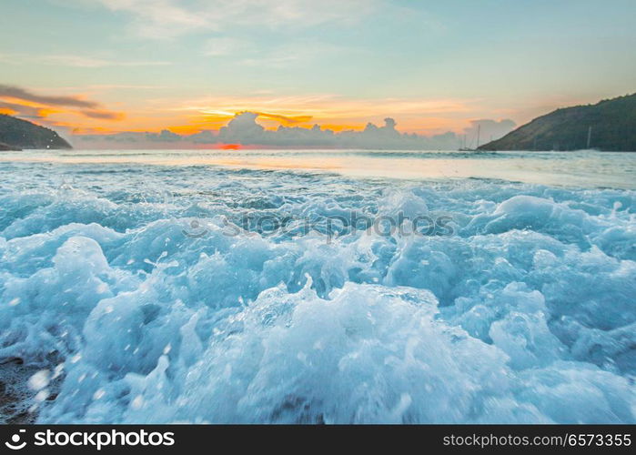 Raging waves at sunset. Close-up view of raging waves on beach at sunset, tropical landscape