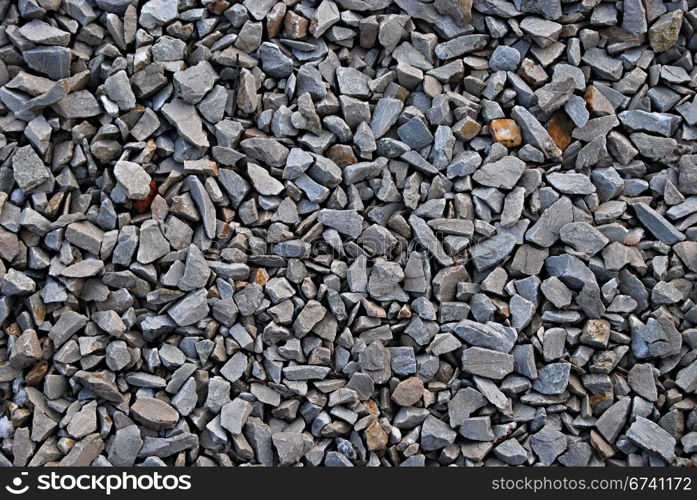 Rail road track ballast stone gravel close-up as background