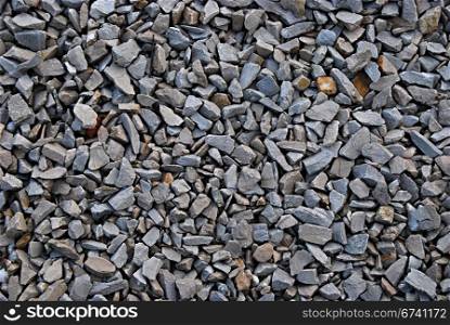 Rail road track ballast stone gravel close-up as background