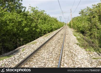 railroad and trees in Italian countryside
