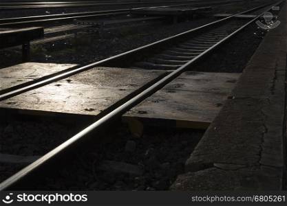 railroad railway track at train station in evening at sunset