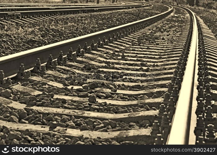 Railroad, that goes into the distance, close-up image with sepia tone