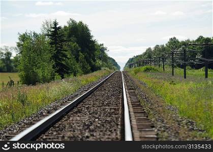 Railroad track passing through a field, Manitoba, Canada