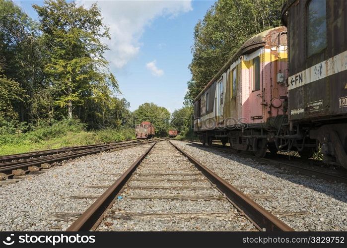 railroad track with old trains in belgium city hombourg