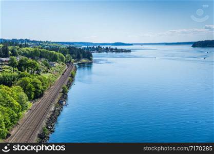 Railroad tracks along the shore of the Tacoma Narrows waterway.