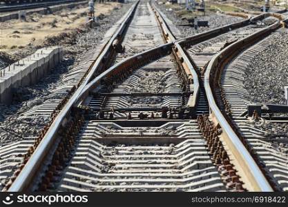 Railroad tracks at the train station. The new railway.. Railroad tracks at the train station