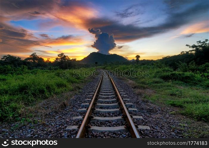 Railroad tracks in the during sunrise, dramatic sunset over railroad.. Dramatic sunset over railroad.