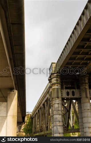 Railway Bridge and Concrete road bridge over River Wye connecting England and Wales, Chepstow, United Kingdom.