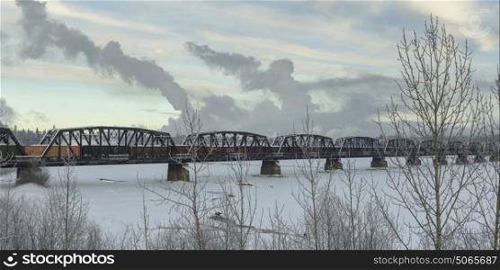Railway bridge over frozen lake, Highway 16, Yellowhead Highway, Prince George, British Columbia, Canada