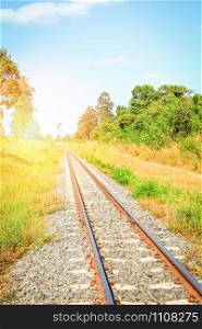 Railway - railroad tracks steel for trains in countryside on nature summer background
