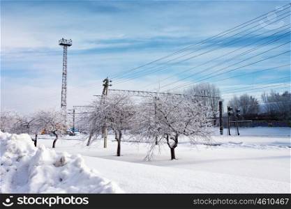 Railway station in winter. Snow-covered urban scene in Belarus