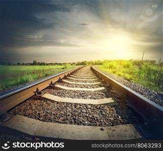 Railway stretches to the sun in the field. Railway stretches to the sun