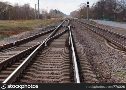 railway stretching into the distance, rails in three rows. rails in three rows, railway stretching into the distance