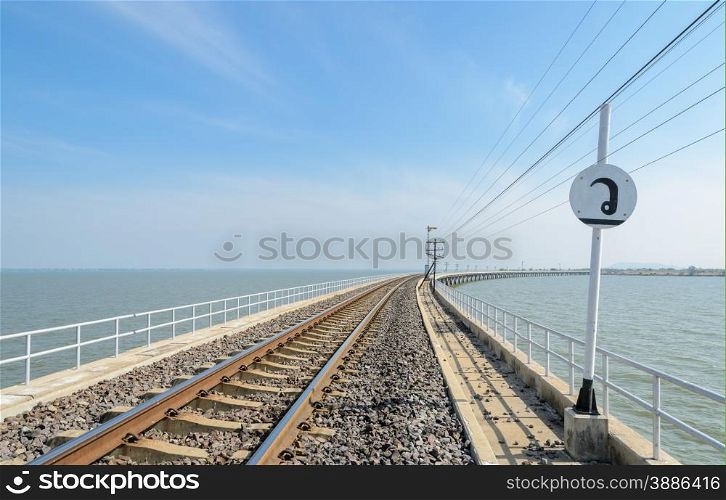Railway track lead across the lake in Thailand