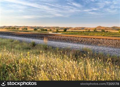 railway tracks along a valley of the Middle Loup River in Nebraska Sandhills, late summer scenery