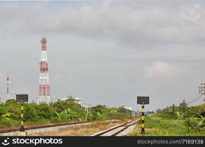 railway with telecommunication station pole.