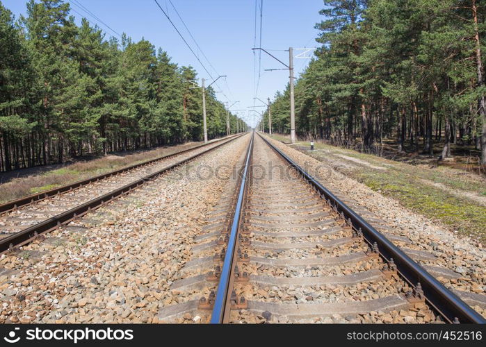 Railways at Latvia, city Carnikava. Urban view, wood and railroad. 2018