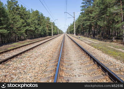 Railways at Latvia, city Carnikava. Urban view, wood and railroad. 2018