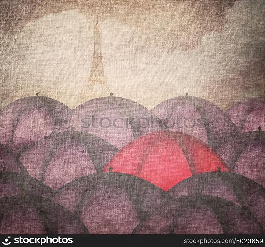 Rain and a red umbrella in a group of blue umbrellas