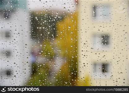 Rain. Autumn seasonal background with rain drops on the window.