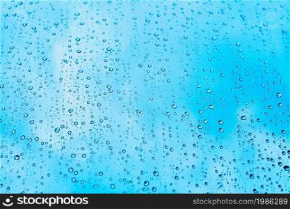Rain. Autumn seasonal background with rain drops on the window.