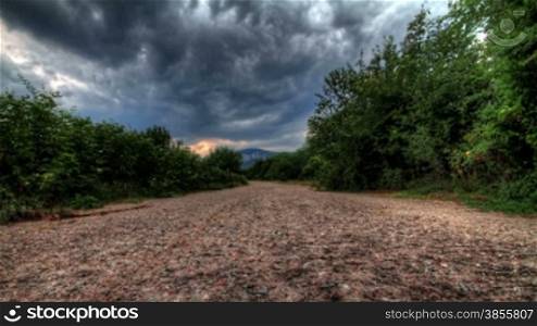 Rain Clouds Over A Mountain Lonely Road. Crimea, Ukraine. HDR Time Lapse Shot Motorized Slider