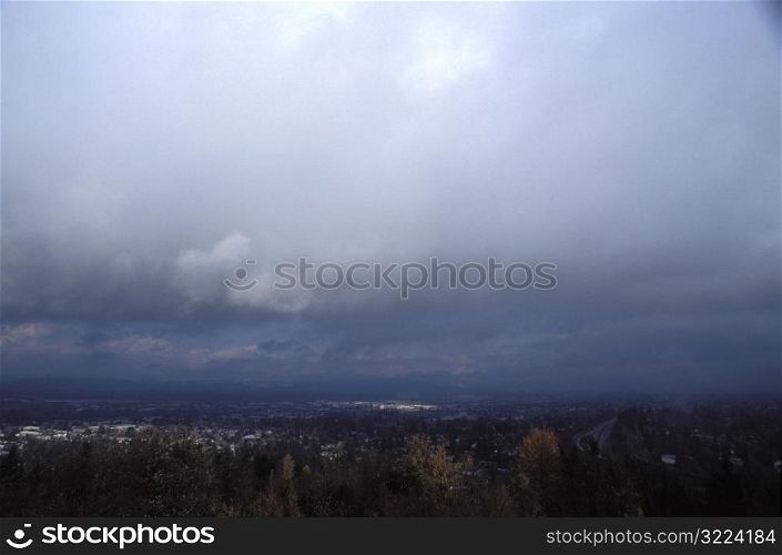 Rain Clouds Over A Mountain Valley