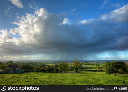 Rain clouds over rural Gloucestershire near Chipping Campden, England.
