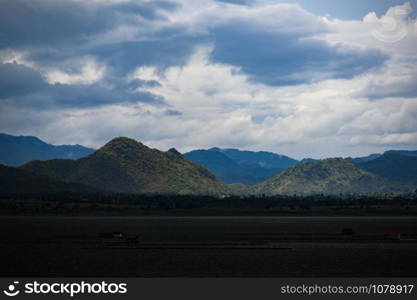 Rain clouds over the mountains by the lake