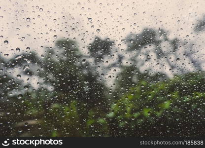 rain drop on glass car on road