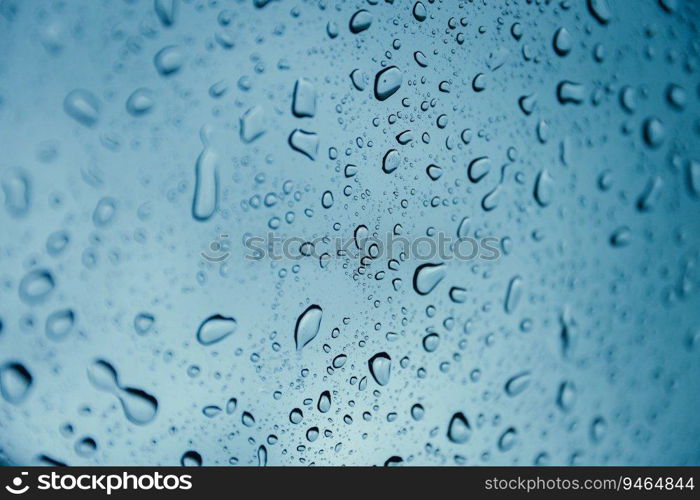 rain drop wet moise on the glass blue cool fresh chill nature background