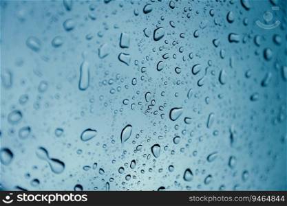 rain drop wet moise on the glass blue cool fresh chill nature background