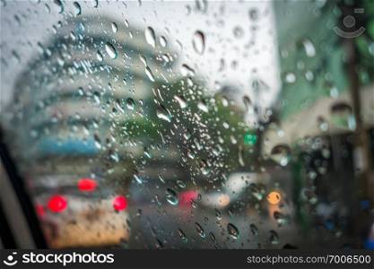Rain drops on a car window, Bangkok, Thailand. Rain drops on a car window