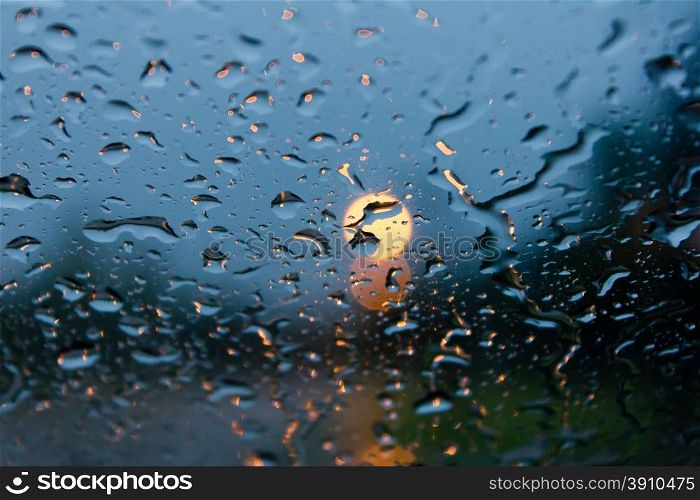 rain drops on car glass in rainy